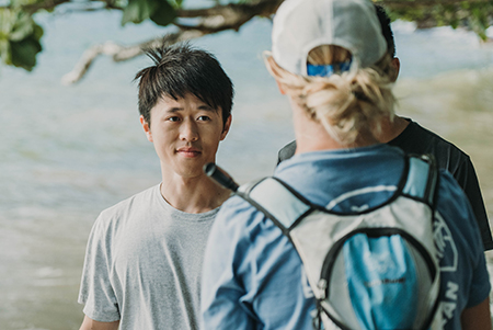 Joe Huang with 4Ocean team members, pulling ghost nets from the ocean shoreline.