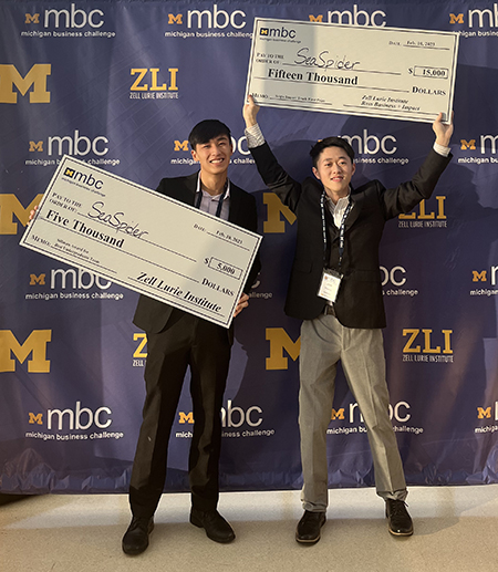 Adam Zhang, BS Environment ’23; and Joe Huang, CS ’22 celebrate winning the 2023 Michigan Business Challenge–Seigle Impact Track.