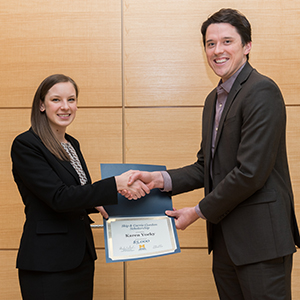 Karen Yocky is presented the Skip and Carrie Gordon Scholarship by Business Impact's Matt Kelterborn.