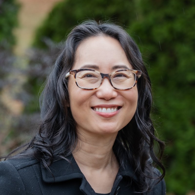 Headshot of Rosalind Chow from the shoulders up smiling.