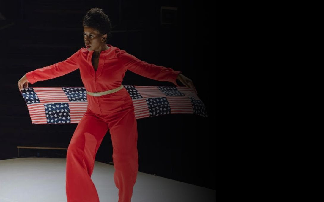 Holly Bass with an American flag in her hands