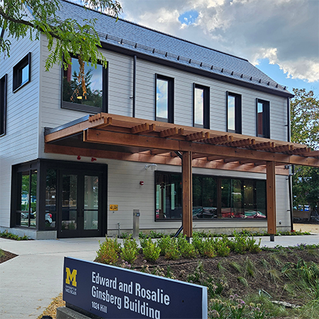 Photo of the U-M Ginsberg Center on a partly cloudy day