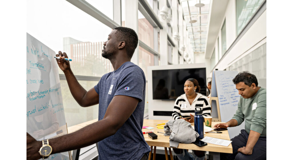 Students in the central campus incubator cohort working on their startups at the Ross School of Business. (Photo courtesy of the Ross Impact Studio)